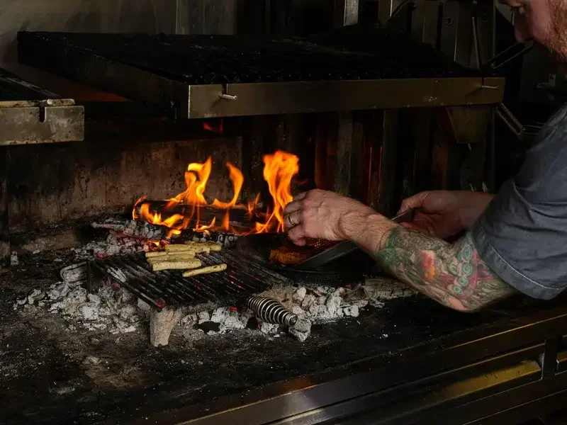 Cooking with embers and ash.