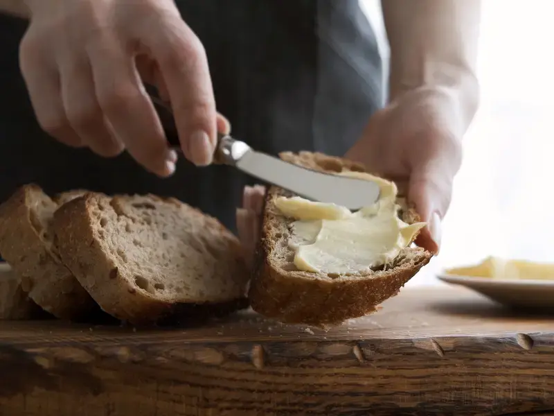 butter-being-spread-on-bread-with-butter-knife