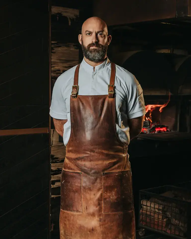 Chef Dave Pynt in a brown apron.