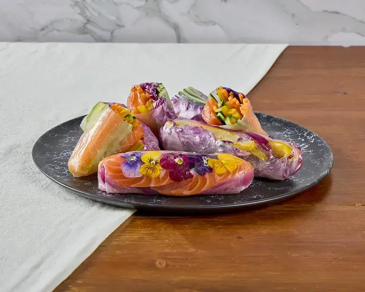 Fresh rolls on a plate on a table.