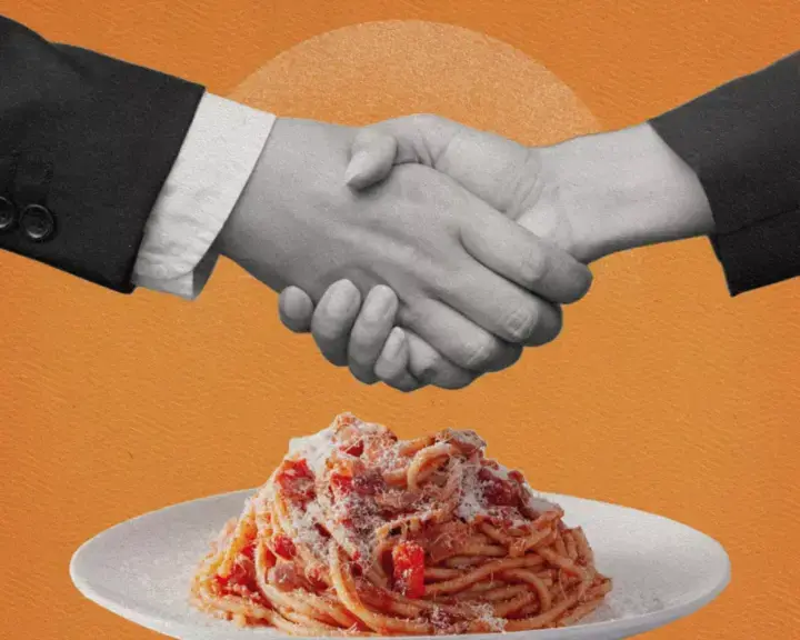 gastro-diplomacy-handsshake-over plate-of-spaghetti